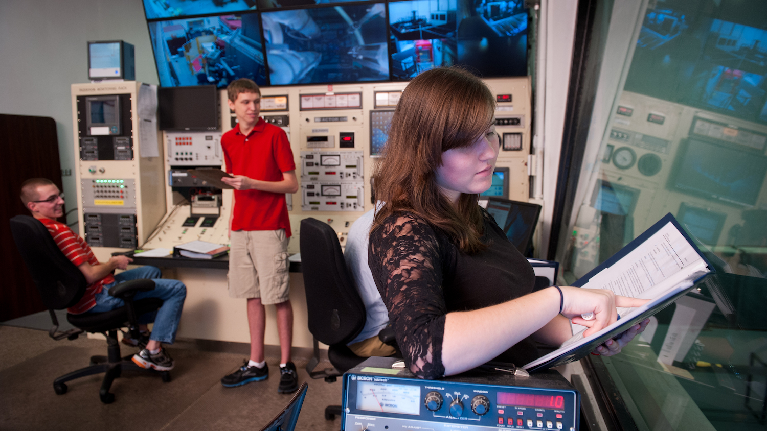 Nuclear engineering students work in the Nuclear reactor in Burlington Labs.