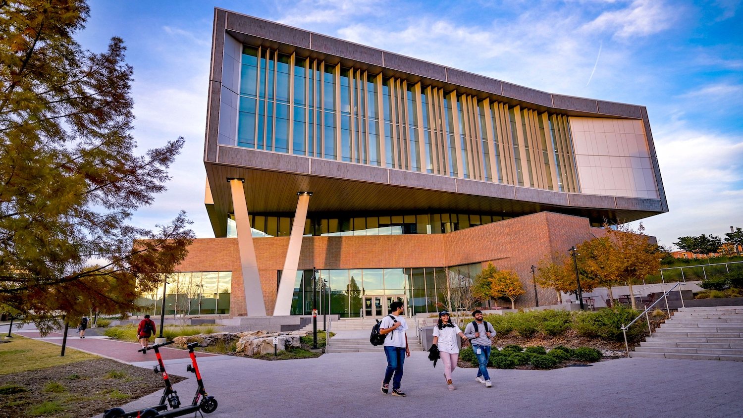 Fitts-Woolard Hall glows with warm light on an early November afternoon.