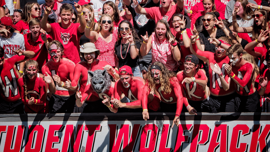 NC State student fans cheer on the Wolfpack during their overtime win over Clemson in 2021.