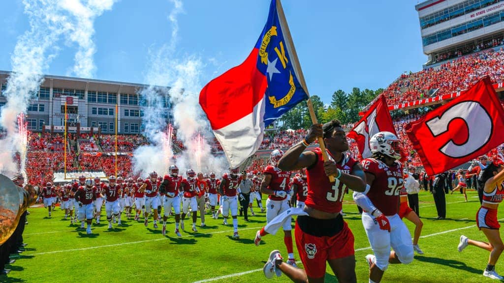 The Wolfpack takes the field for a football game during homecoming week.