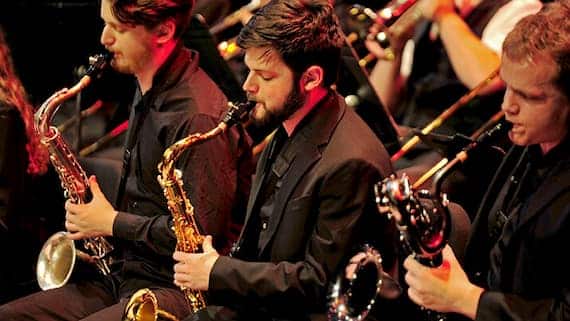 A trio of saxophone players performing at NC State.