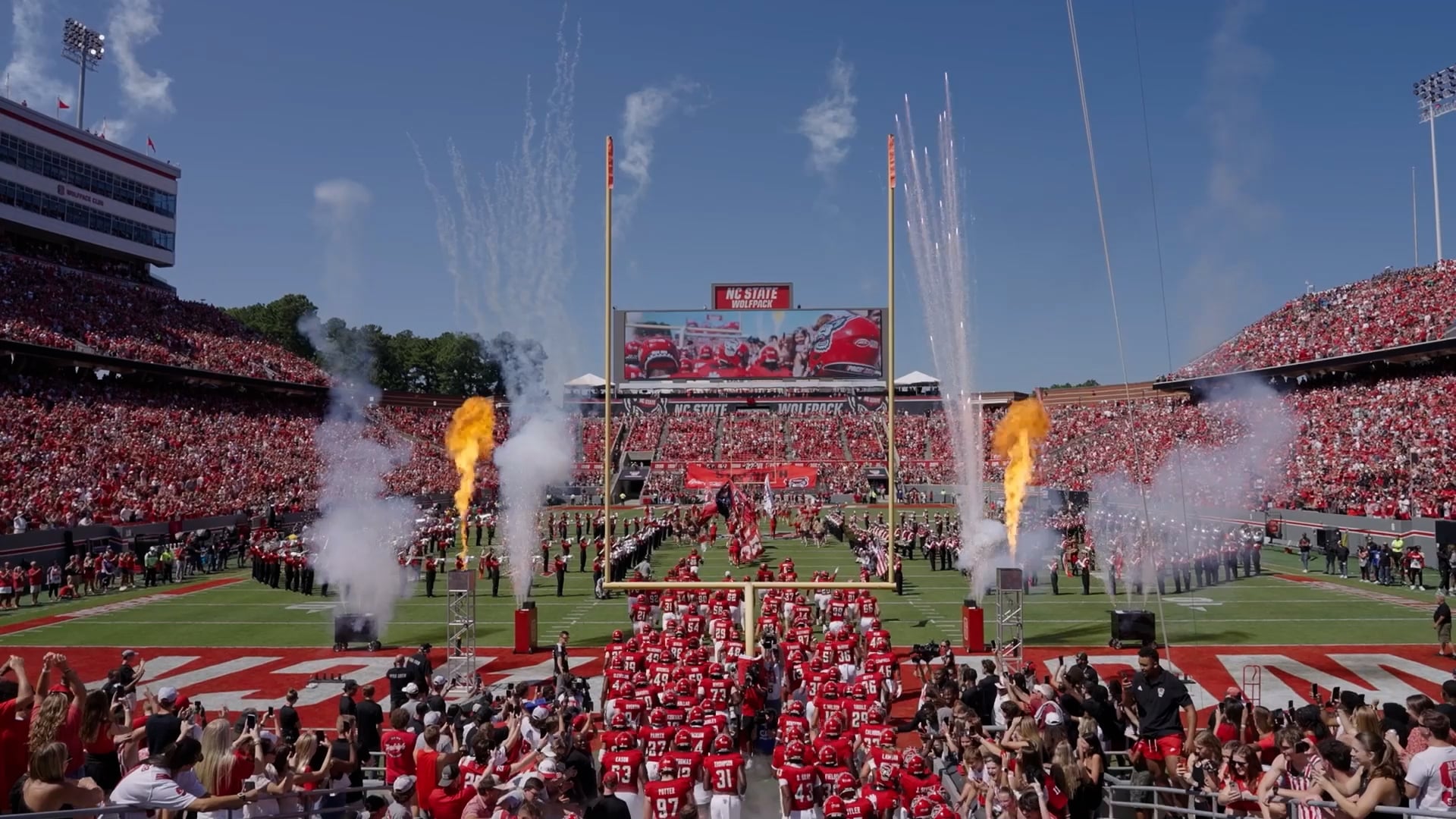 The Wolfpack football team takes the field during the homecoming game.