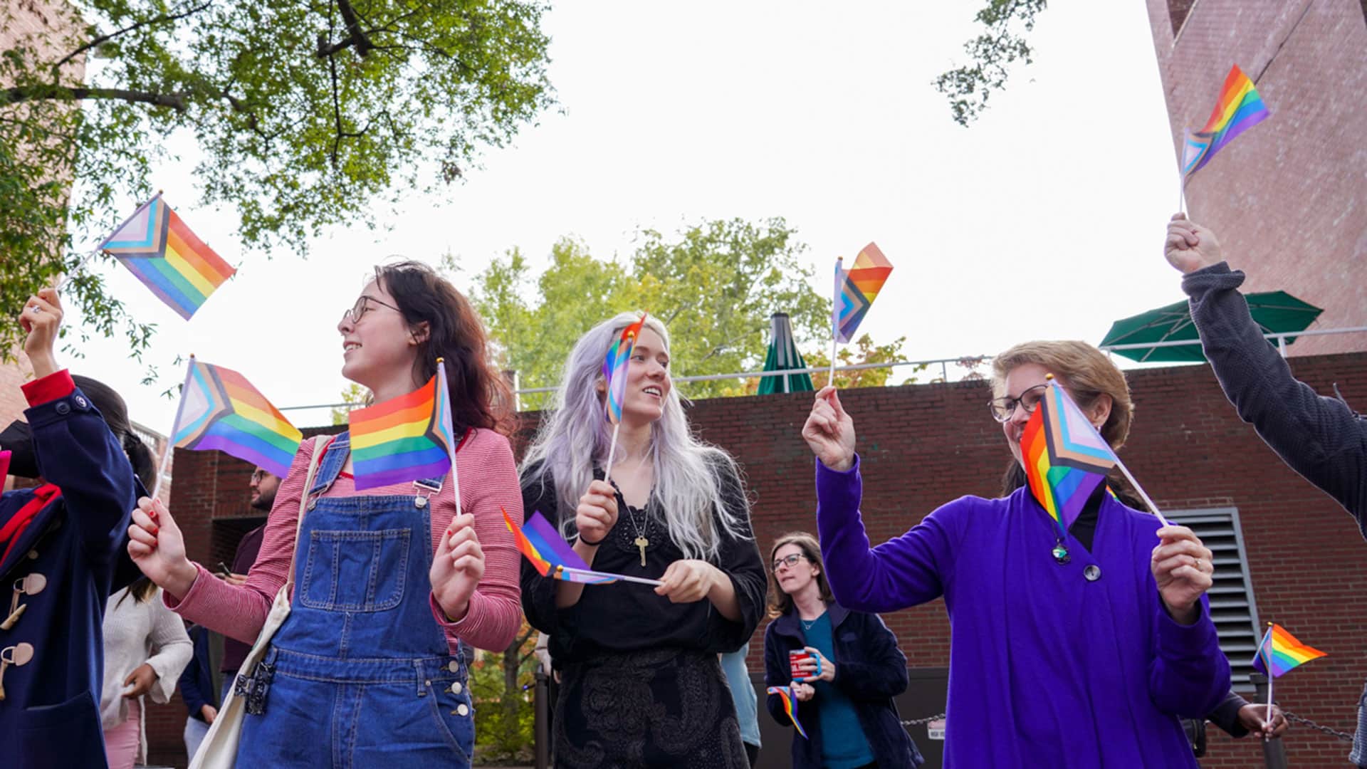 NC&#160;State students, staff, faculty and friends of the Wolfpack wave rainbow Pride flags during the 2022 Pride Walk.