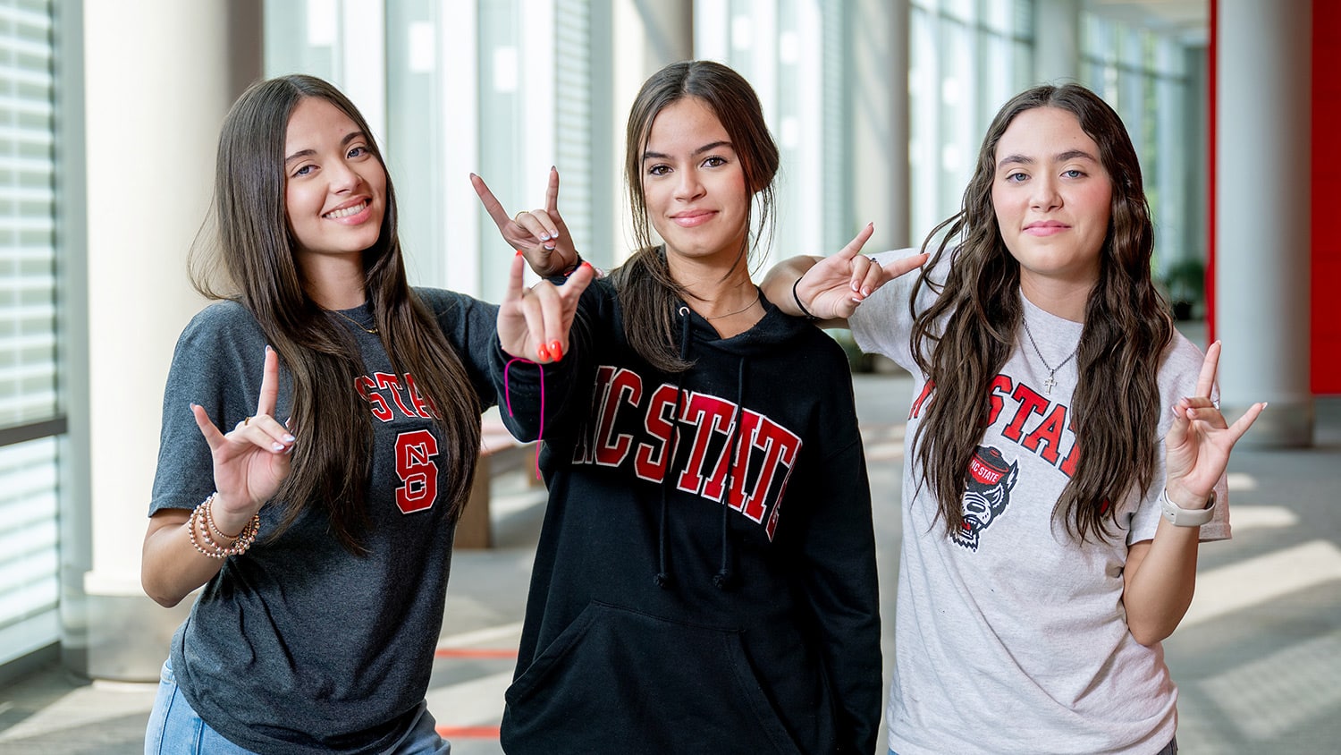 Portrait of Natalie, Kaylee and Allison Toro taken inside Talley Student Union.