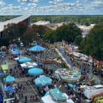 An overhead view of attractions and food stands at the North Carolina State Fair.