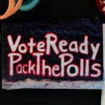 A mural on the Free Expression Tunnel reads "Vote Ready. Pack the Polls."