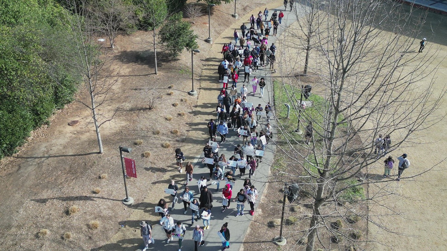 Students march through Stafford Commons during the annual "March Like Martin" event.