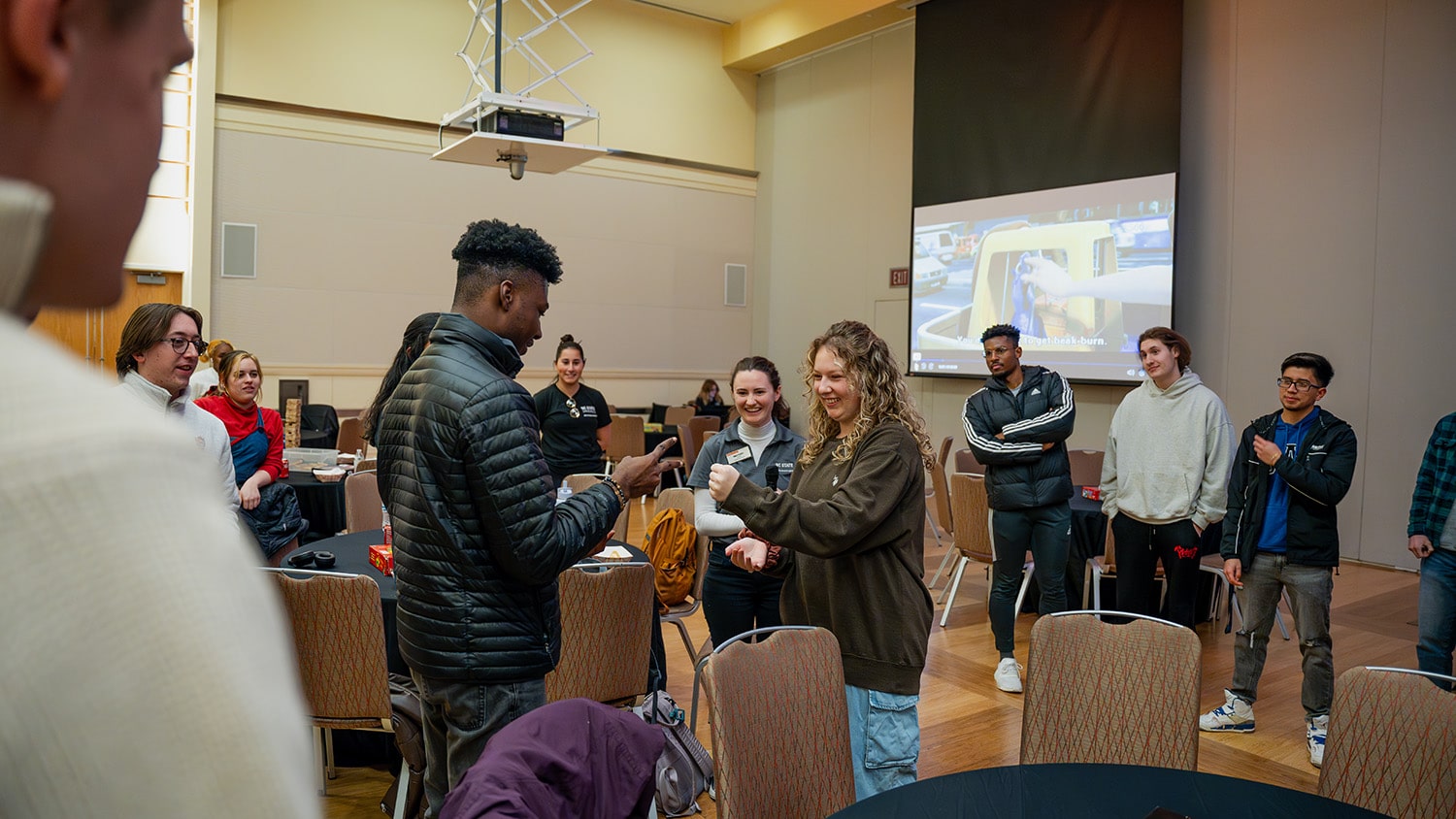 Transfer students take part in rock, paper, scissors during a Winter Welcome Week event.